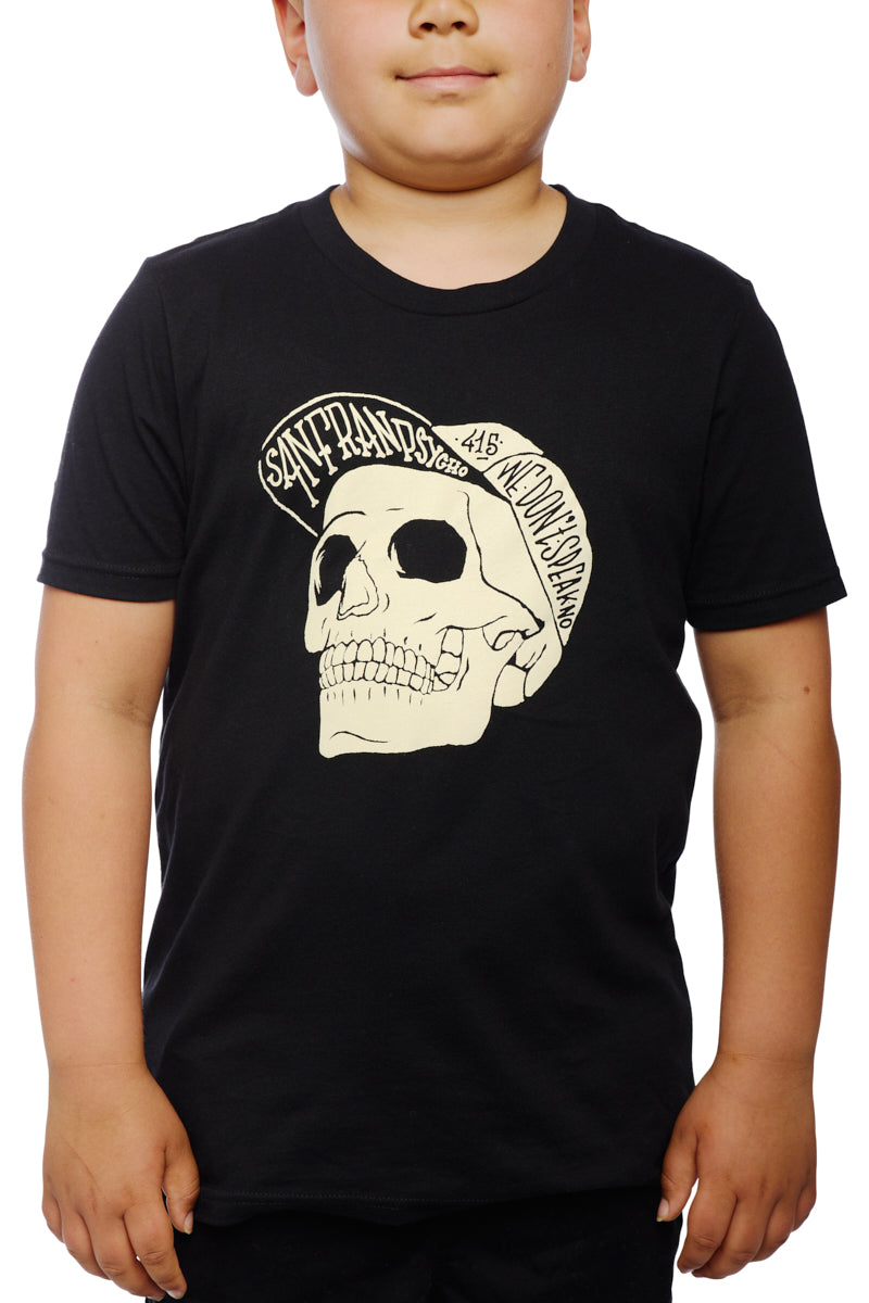 A child wearing the Youth Black Street Skull Tee, made from 100% cotton, featuring a graphic and text design.