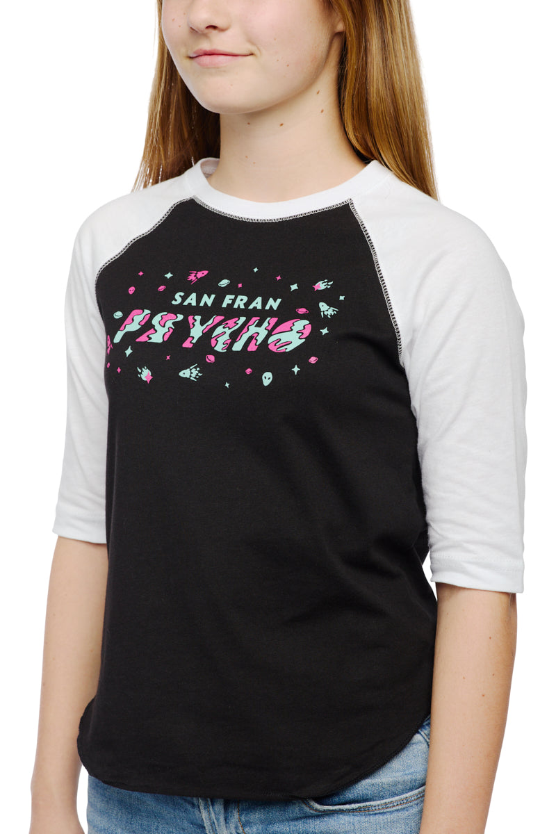 A girl is rocking a black and white Youth Planet Rock Baseball Tee paired with casual jeans, channeling those quintessential 90s vibes.