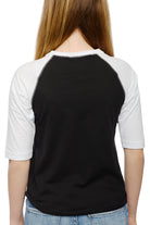 Back view of a person with long hair wearing the Youth Planet Rock Baseball Tee paired with jeans, channeling those 90s vibes.