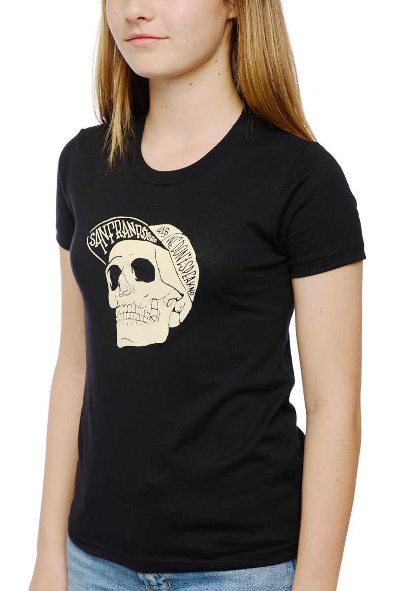 A person wearing the Youth Black Street Skull Tee made from 100% cotton, showcasing a striking skull design and bold text.