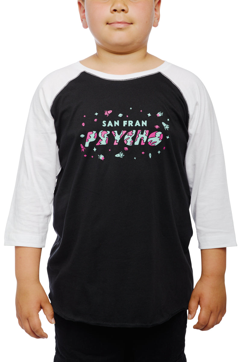 A child sports the Youth Planet Rock Baseball Tee, featuring a black and white design adorned with San Fran Psycho text and vibrant graphics, exuding classic 90s vibes.