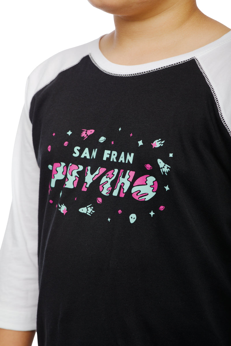 A child rocks the Youth Planet Rock Baseball Tee, showcasing black and white colors with San Fran Psycho and space-themed graphics that evoke a 90s vibe.