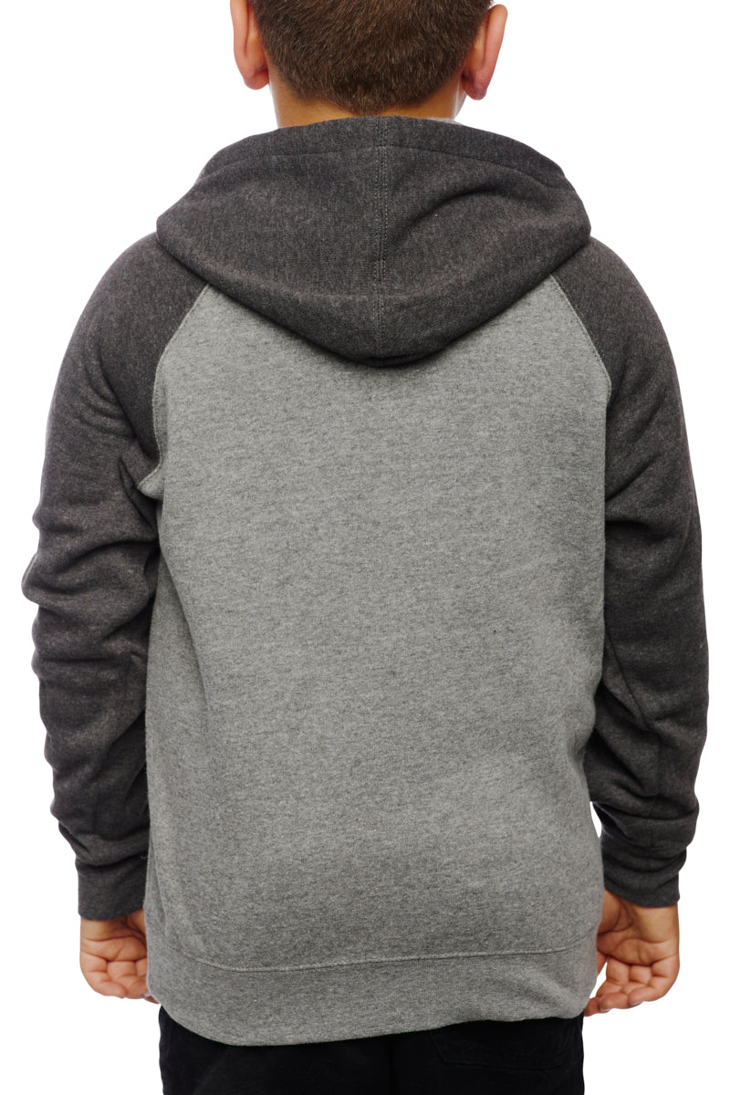 A child in a Youth Two Tone Patch Hoodie, facing away, against a pristine white background.