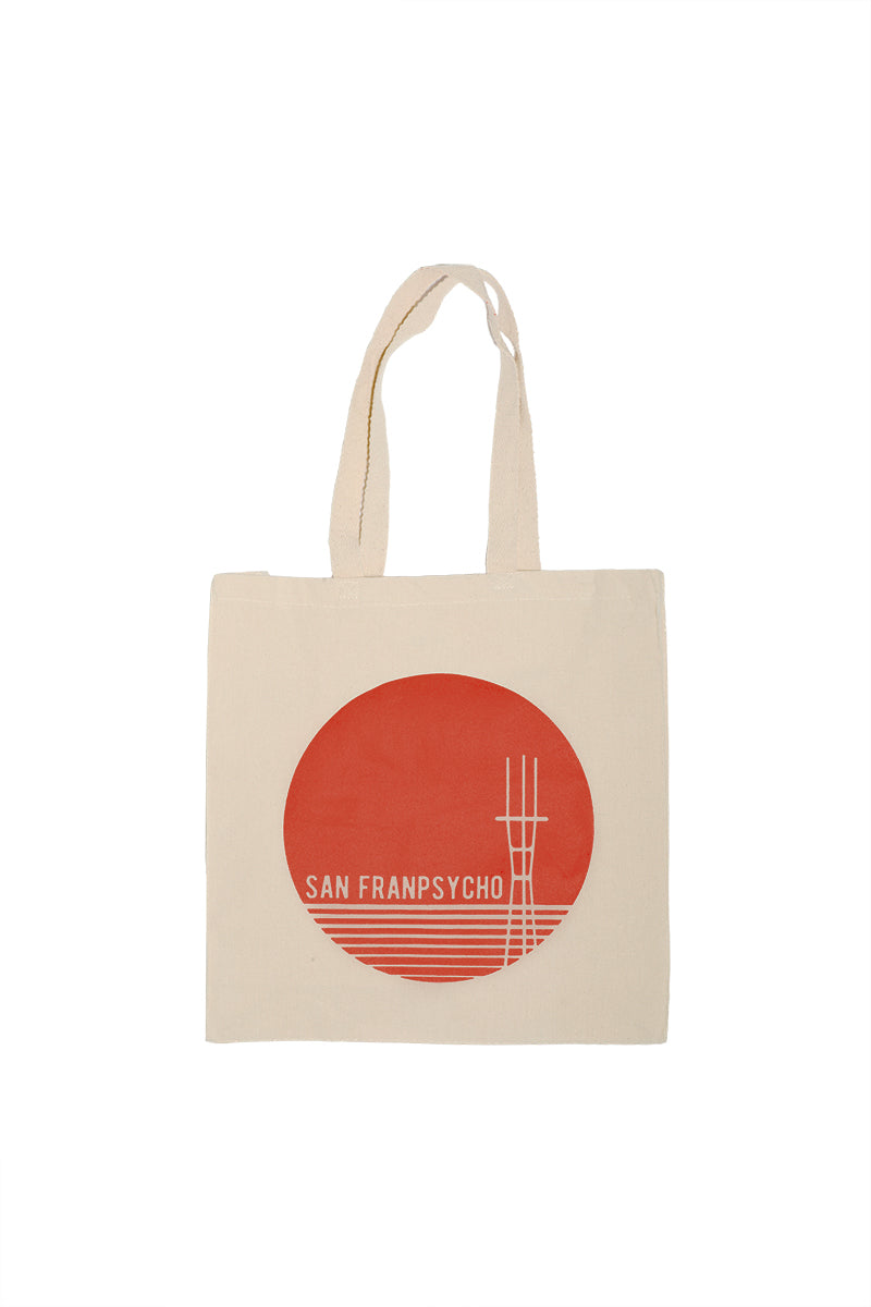 The Sunset Sutro Tote is a beige canvas bag with a red circle, white lines, and San Franpsycho text on the front—perfect for showing off your San Francisco style.