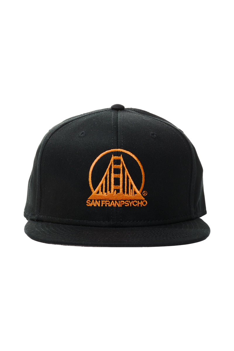 The Embroidered Logo Snapback in Black & Orange features a curved brim, adjustable back, and an orange Golden Gate Bridge logo with San Franpsycho text on the front. One size fits most.