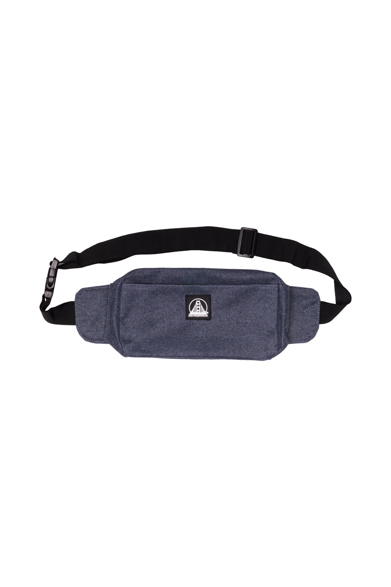 The Sling Bag is a blue fabric waist pouch with an adjustable strap, zippered pockets, and a front logo patch—ideal for those seeking both style and practicality.
