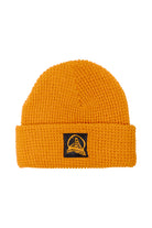 The Orange Waffle Beanie w/ Black/Orange Acid Logo is a vibrant orange acrylic beanie featuring a black patch with an embroidered design on the front.