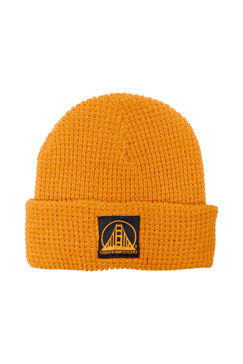 Orange Waffle Beanie with a black and orange logo patch featuring a bridge design on the front, ideal for a day out in the city or expressing your San Franpsycho style.