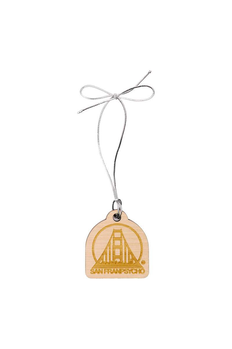 The SFP Wood Ornament features a laser-etched bridge design and San Franpsycho text, tied with a silver string. This wooden tag embodies the citys spirit with precision and charm.