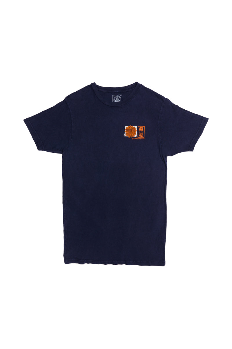 The Sunset Dahlia Tee is a navy blue shirt with a small orange and yellow Japanese art-inspired graphic on the left chest, finished with a vintage mineral wash.