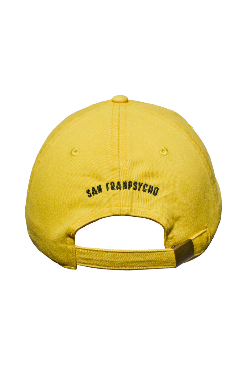 The Smiley Dad Hat is a comfortable yellow baseball cap, shown from the back with “San Franpsycho” embroidered above the adjustable strap. Its classic fit makes it perfect for everyday wear.