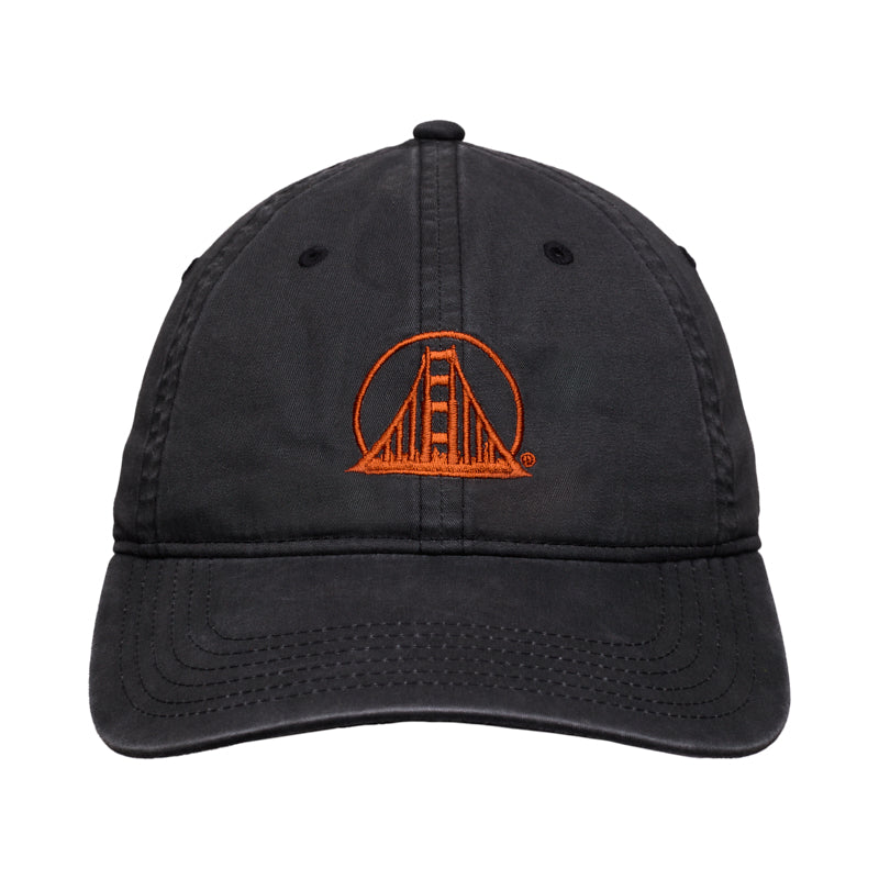 The Rust Logo Dad Hat showcases a faded black design with an orange Golden Gate Bridge logo embroidered on the front, blending classic style and distinctive Bay Area character.