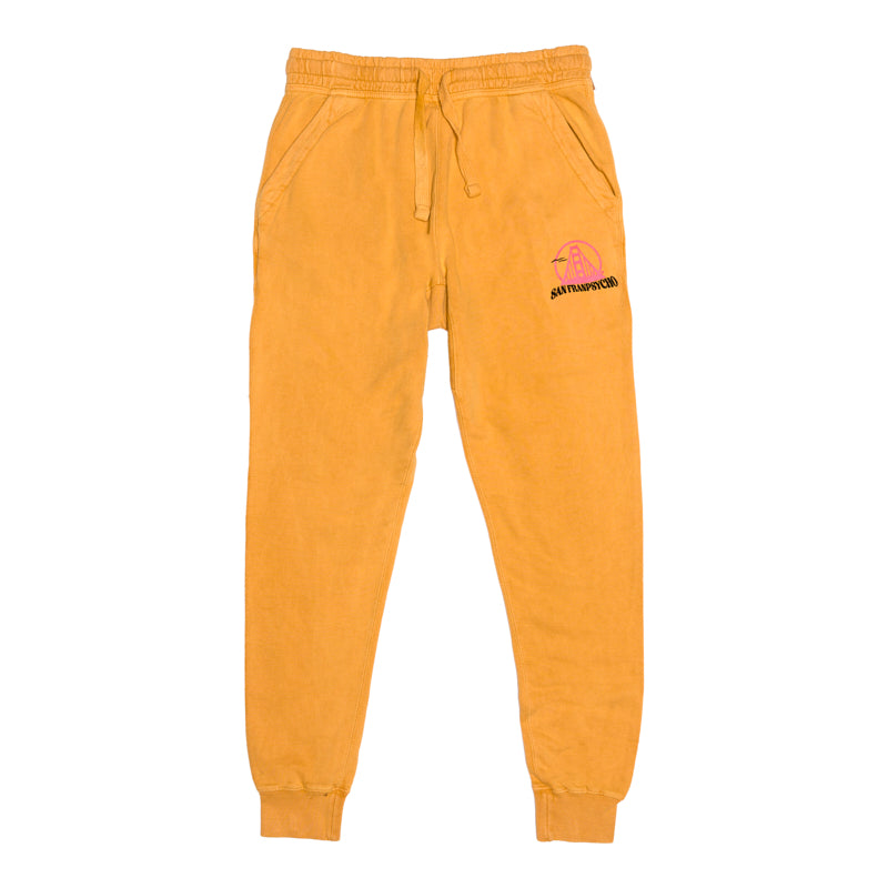 Kelly's Cove Joggers in bright yellow feature cotton fabric, elastic cuffs, a drawstring waist, handy pockets, and a small left-thigh graphic—perfect for adding comfort and color to your casual style.