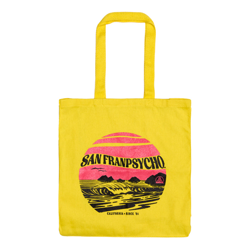 The Kelly's Cove Tote is a bright yellow canvas bag with SAN FRANPSYCHO and a colorful sunset graphic inspired by San Francisco’s vibrant vibes.