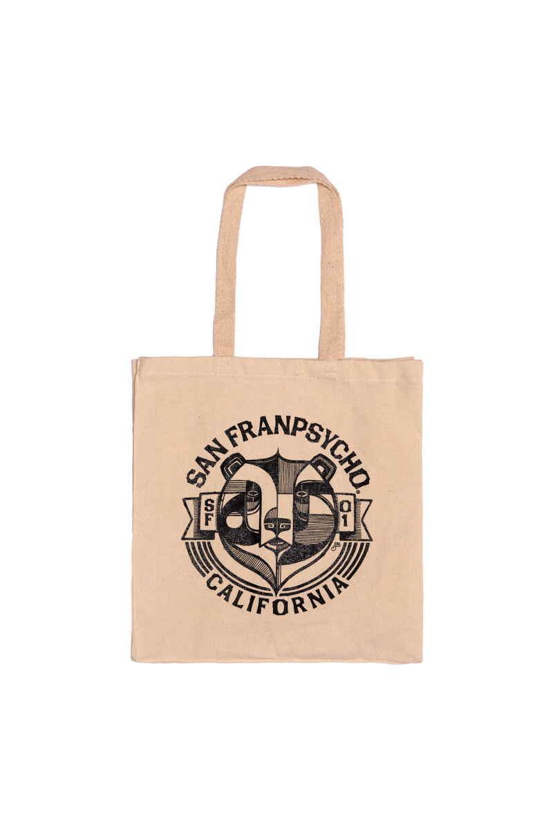 The Bear Essentials Tote is a beige canvas bag with "San Franpsycho California" and a bold black California bear graphic—an ideal accessory for San Francisco enthusiasts.
