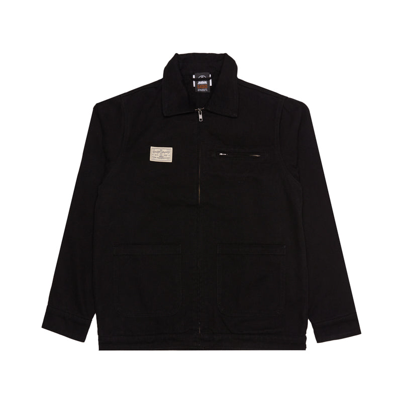 Bridge Co. Chore Jacket—black zip-up workwear with a collar, chest label, and front pockets, laid flat on a white background; a timeless piece made in San Francisco.