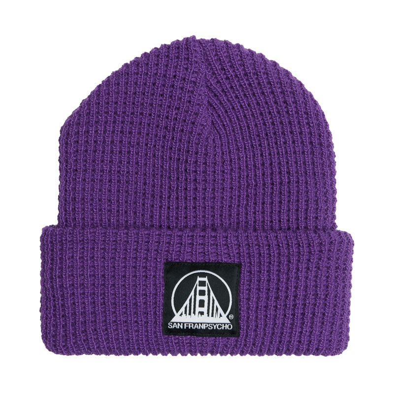 The Purple Waffle Beanie w/ Black/White Logo features a black patch with a white bridge and San Franpsycho on the front cuff, making this cozy acrylic beanie perfect for fans of city-inspired style.