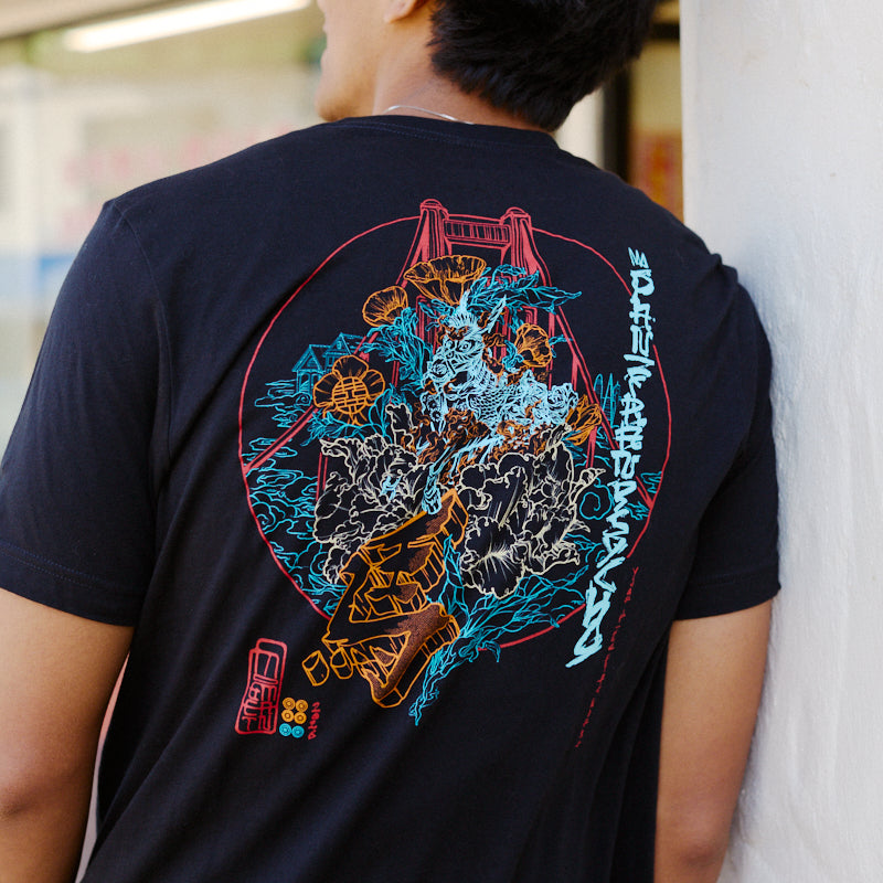 A man wears the Year of the Horse Tee, featuring a vibrant graphic on the back, standing outdoors—an ideal choice for celebrating Lunar New Year in style.