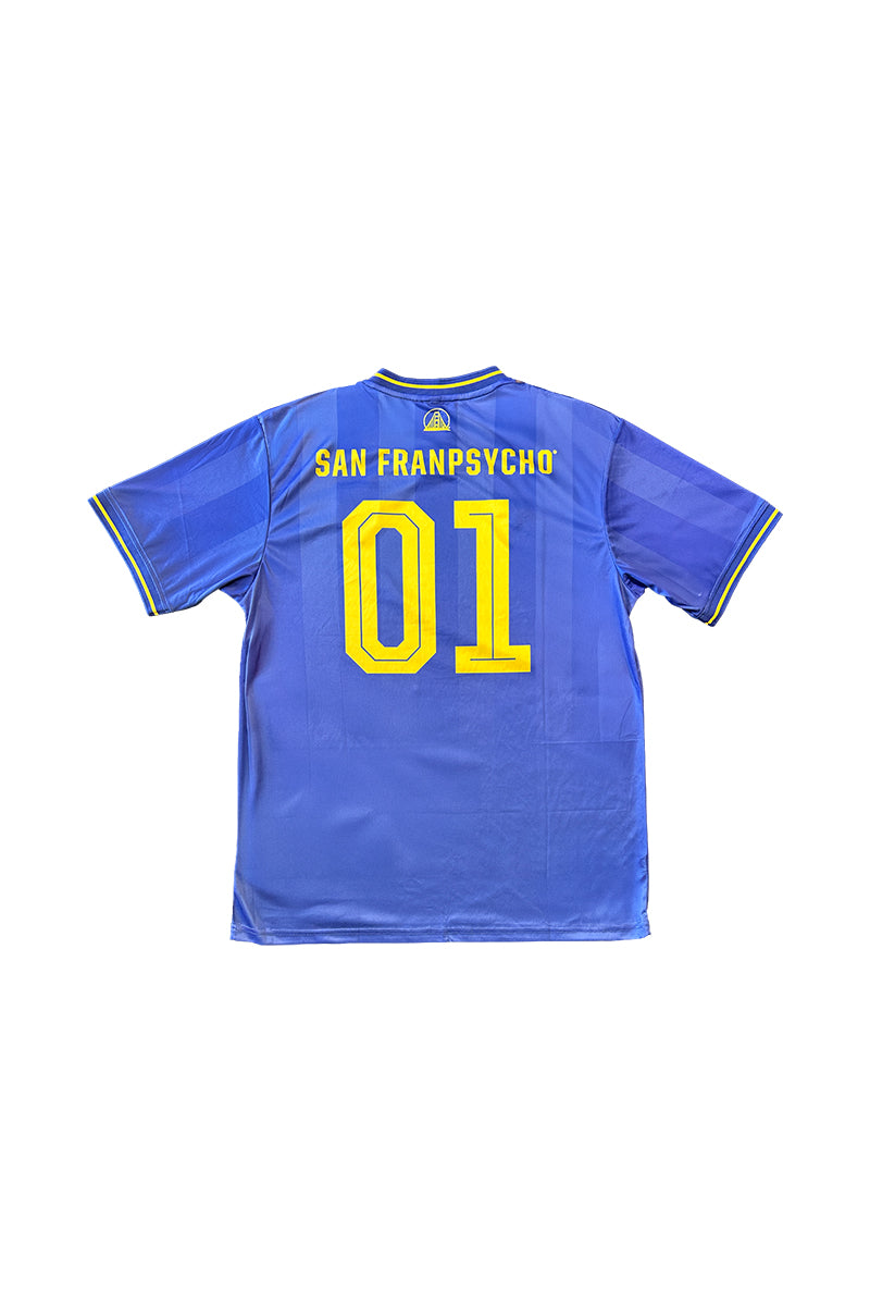 The WC x SFP Jersey - Blue features yellow trim, SAN FRANPSYCHO, and the number 01 on the back—a fan favorite inspired by classic World Cup jerseys.
