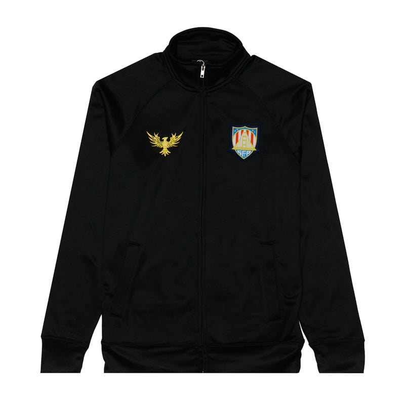 The WC x SFP Zip-Up Jacket features a gold eagle emblem and colorful shield crest on the chest, inspired by the US Men's National Team, shown laid flat on a white background.