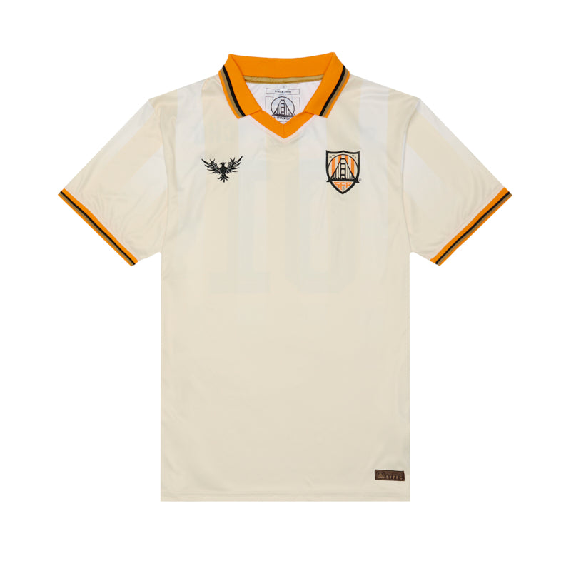 Show your support with the WC x SFP Jersey - Away, featuring a cream fan-fit design, orange collar and sleeve trim, team crest, and bold black chest logo—perfect as a US Men's National Team jersey.