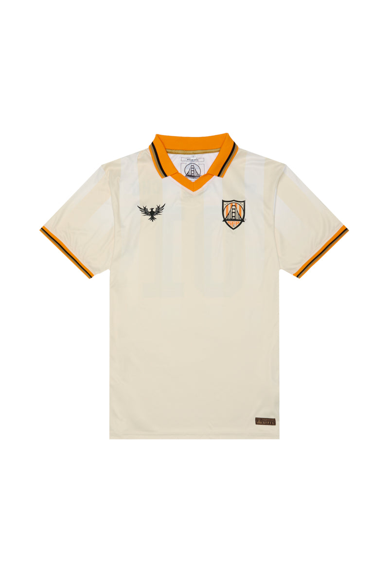 Show your support with the WC x SFP Jersey - Away, featuring a cream fan-fit design, orange collar and sleeve trim, team crest, and bold black chest logo—perfect as a US Men's National Team jersey.