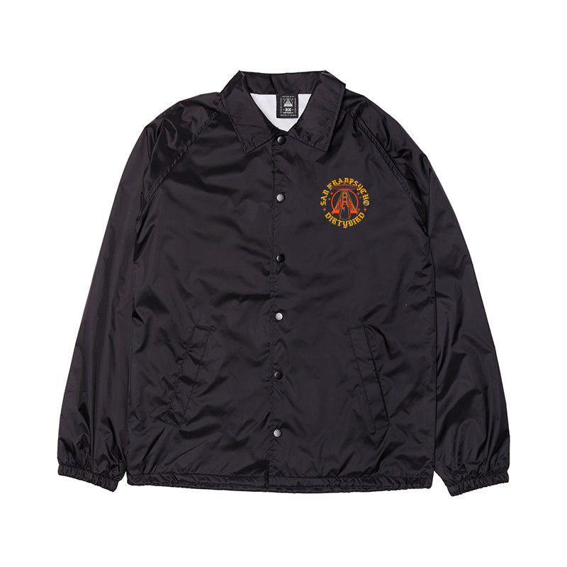 The Dirty UFO Coaches Jacket features black snap buttons and a yellow-red graphic on the left chest, shown flat on a white background. This jacket is part of the exclusive SFP x Dirtybird collaboration.