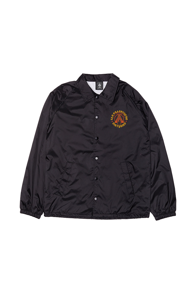 The Dirty UFO Coaches Jacket features black snap buttons and a yellow-red graphic on the left chest, shown flat on a white background. This jacket is part of the exclusive SFP x Dirtybird collaboration.