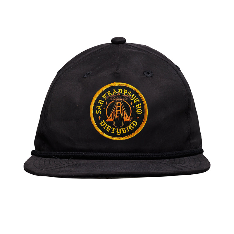 Dirty UFO Hat: Black baseball cap with a yellow embroidered circular patch featuring text and a bridge—celebrating Bay Area culture in this unique SFP x Dirtybird collaboration.
