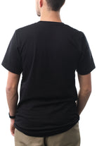 A person is wearing the Surf Club Tee and khaki pants, viewed from behind against a white background.