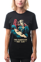 Person wearing an incredibly soft Surf Club Tee by San Franpsycho, showcasing a graphic of a skeleton surfing.
