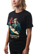 A person wears a super soft black Surf Club Tee that showcases a skeleton surfing design along with the text "San Franpsycho Surf Club.