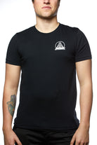Person wearing the Black & Orange Street Skull Tee, crafted from soft Airlume cotton, featuring a white logo on the chest. A tattoo is visible on their right forearm.