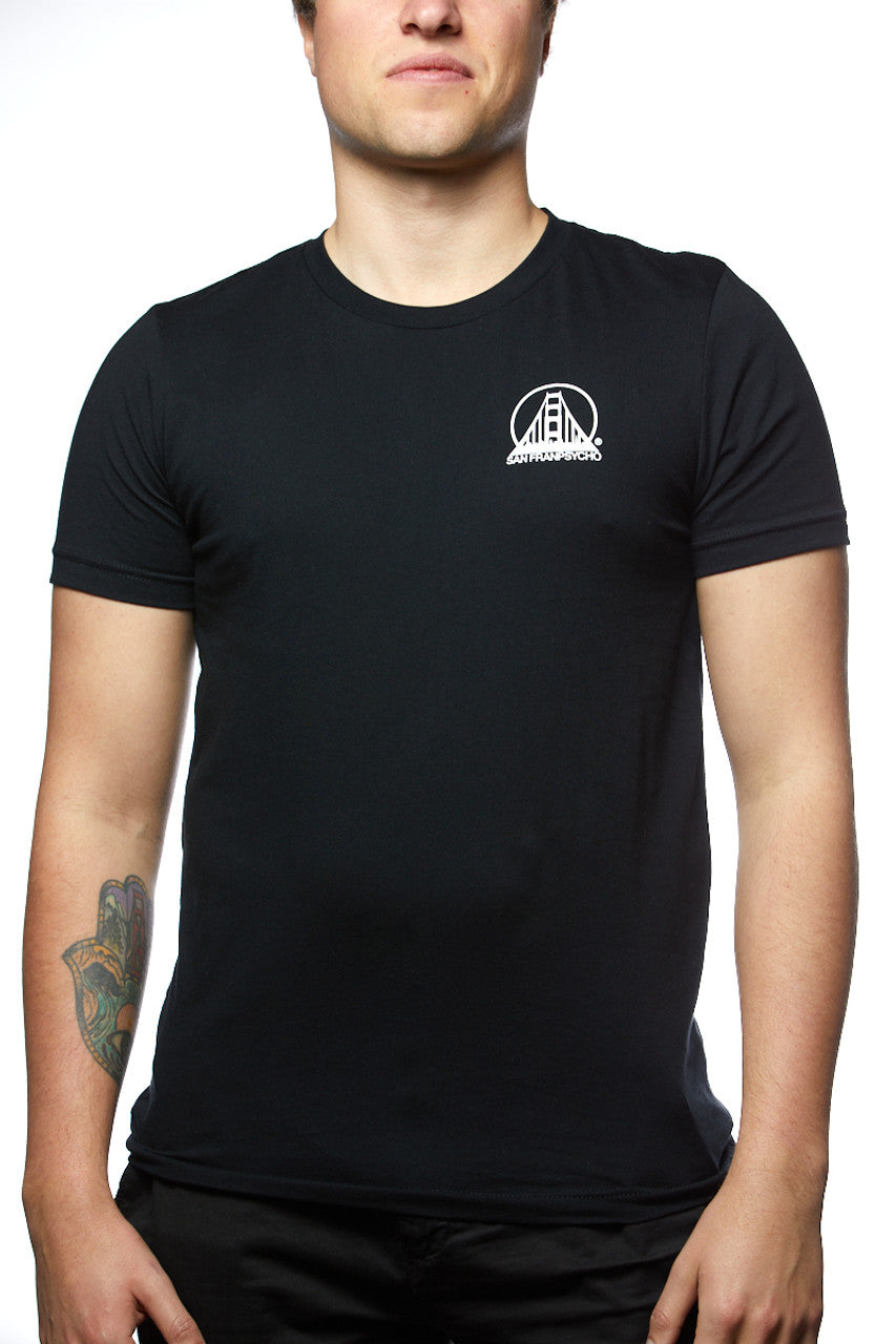 Person wearing the Black & Orange Street Skull Tee, crafted from soft Airlume cotton, featuring a white logo on the chest. A tattoo is visible on their right forearm.