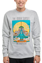 A person wearing a gray Inner Sunset Crewneck sweatshirt, featuring a colorful cityscape design inspired by San Francisco's vibrant surroundings.