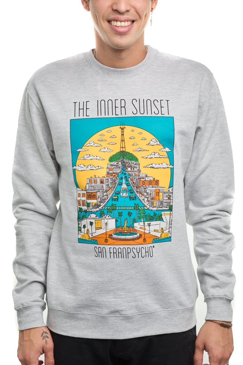 A person wearing a gray Inner Sunset Crewneck sweatshirt, featuring a colorful cityscape design inspired by San Francisco's vibrant surroundings.