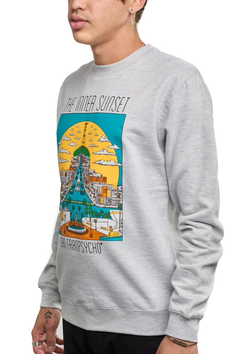 A person wears an Inner Sunset Crewneck, showcasing a vibrant cityscape illustration reminiscent of San Francisco's Inner Sunset and capturing the lively essence of Golden Gate Park on the front.