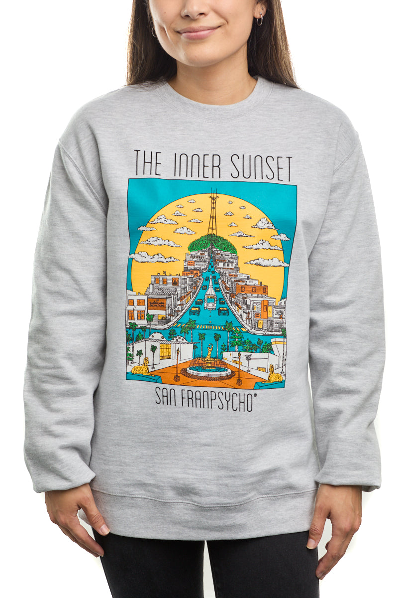 A person wears the Inner Sunset Crewneck, featuring a vibrant graphic that captures the essence of San Francisco's Inner Sunset, near Golden Gate Park.