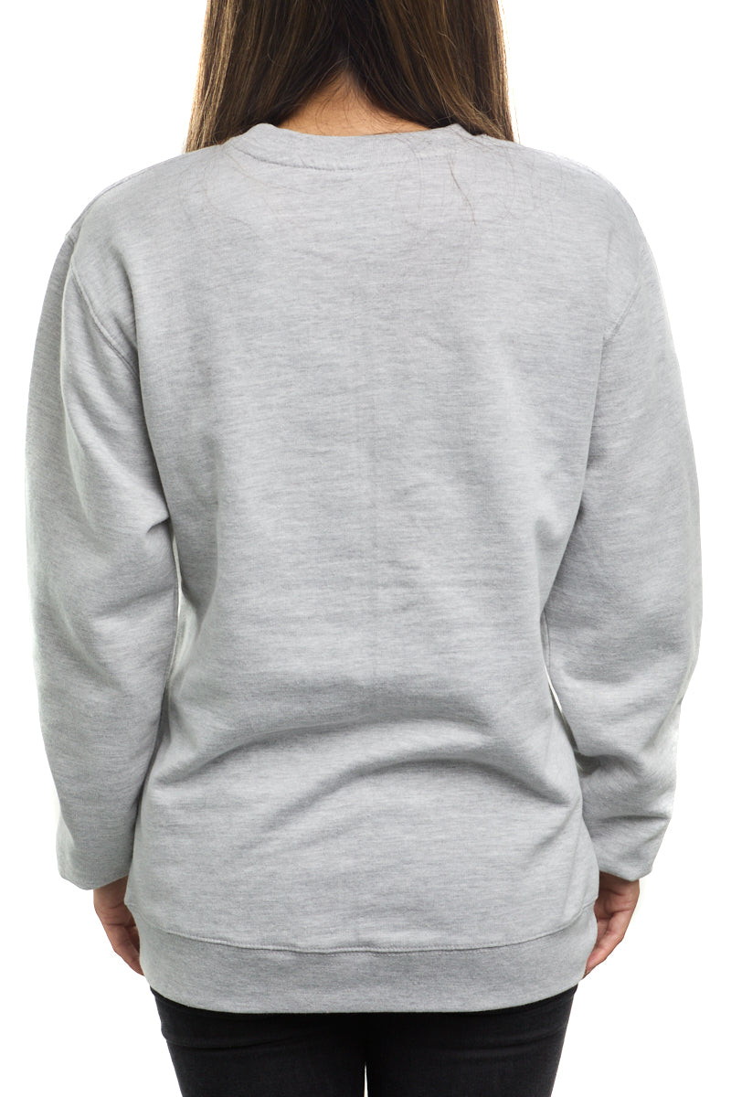 A person wearing an Inner Sunset Crewneck and black pants stands facing away from the camera against a white background, reminiscent of the serene pathways of Golden Gate Park in San Francisco.