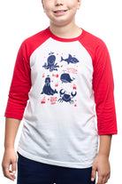 A child wears the Youth Ocean Club Baseball Tee, a fun red and white shirt with cartoon sea creatures and Since Ocean Beach text. Made from 100% cotton, its perfect for young ocean club fans seeking comfort.