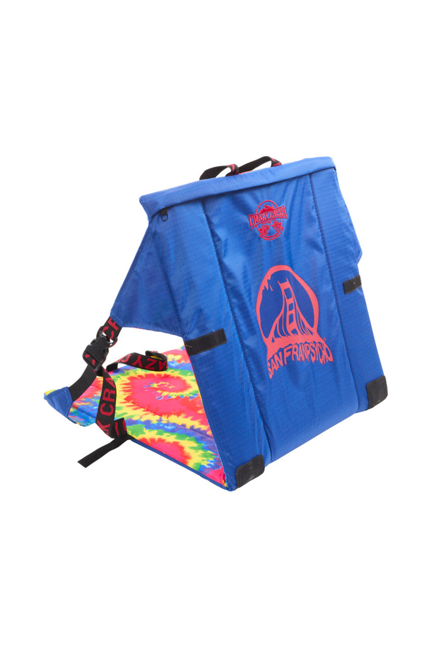 The SFP Crazy Creek Outdoor Chair, showcasing a blue San Francisco theme with a tie-dye cushion and adjustable straps, is available for pickup only.