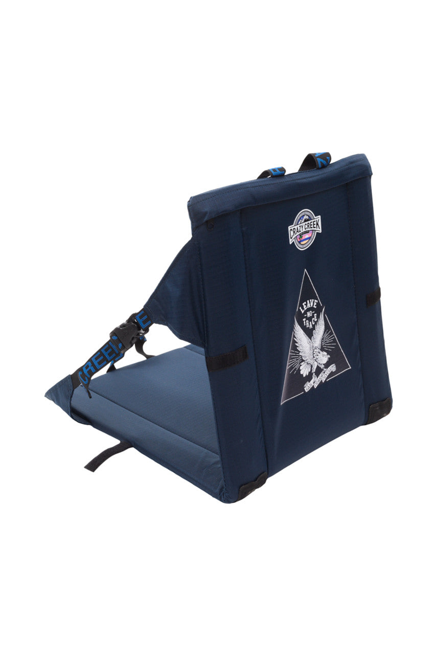 SFP Crazy Creek Outdoor Chair features a blue design with an eagle graphic on the backrest and comes with adjustable straps. It is available exclusively for in-store purchase and pickup.
