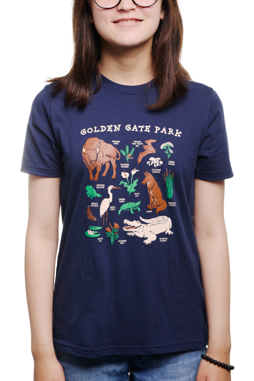 Someone wearing a Youth Golden Gate Park Animals Navy Tee, featuring charming illustrations of animals and plants.