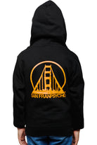 Child in the Youth Black & Orange Logo Zip-Up Hoodie made from 100% cotton, featuring the San Franpsycho and orange bridge design on the back, paired with blue jeans.