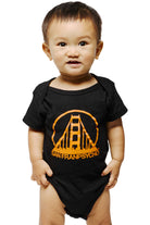 A baby wearing a Black & Orange Logo Onesie made of soft combed cotton, featuring an orange bridge logo and the words SAN FRANPSYCHO.
