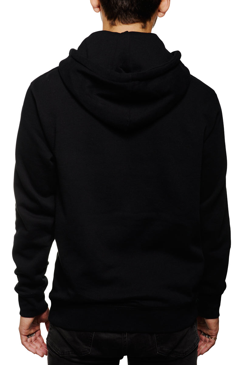 A person wearing the Black Muir Woods Patched Zip-Up Hoodie and jeans stands with their back to us against a white backdrop, embodying the spirit of 'Free To Wander' in their comfortable 100% cotton ensemble.