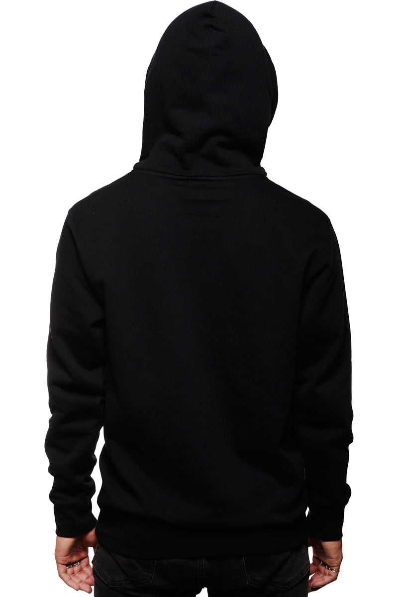 A person in a Black Muir Woods Patched Zip-Up Hoodie, hood raised and facing away against a white backdrop, evokes the spirit of "Free To Wander," offering a comfort as natural as 100% cotton.