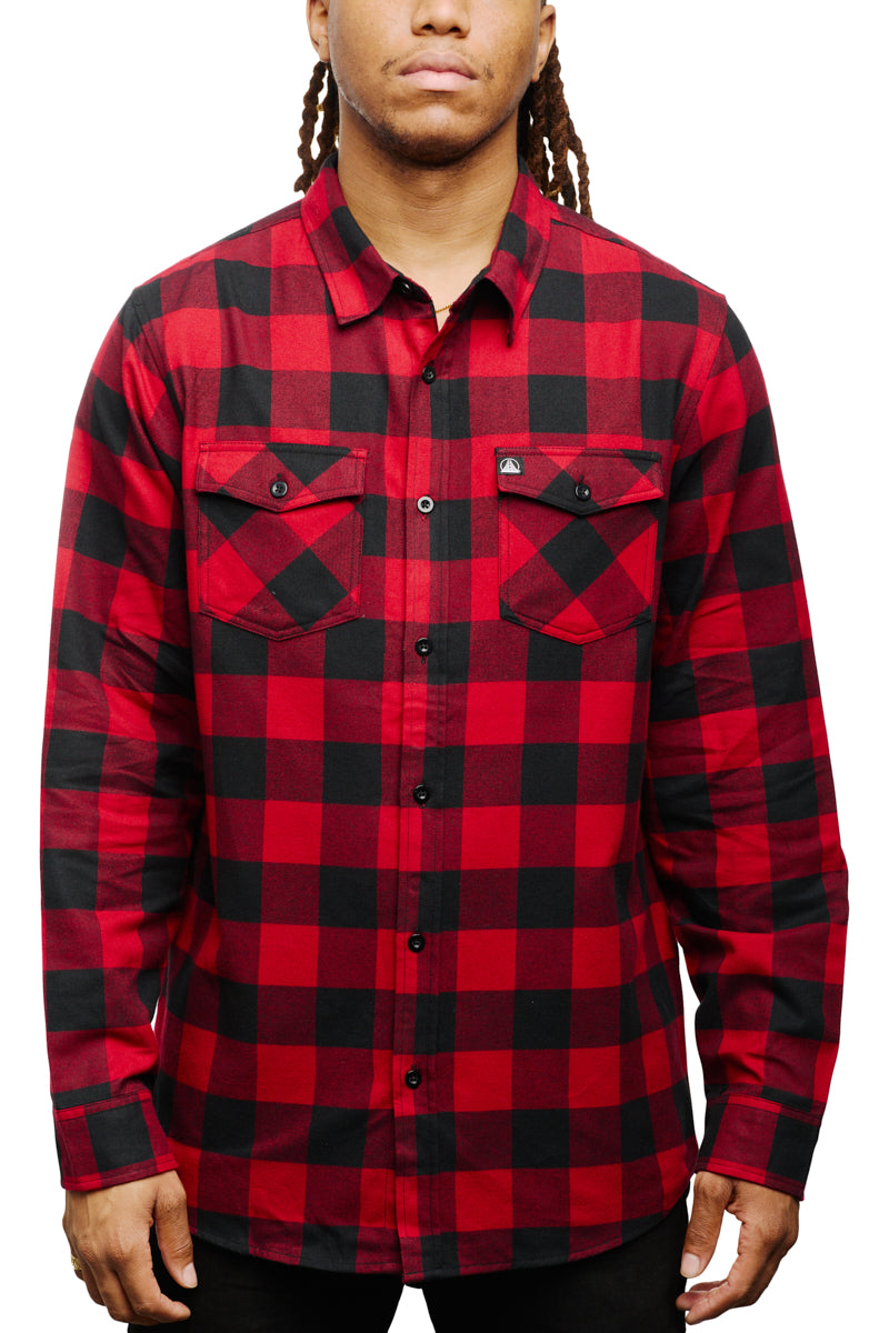 Person wearing a Red & Black Checkered SFP Flannel with buttoned pockets, standing against a white background.