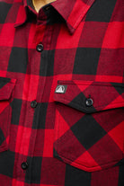 Close-up of a super soft Red & Black Checkered SFP Flannel shirt featuring buttoned pockets, crafted from a cozy cotton polyester blend.