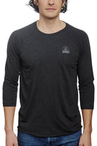 A person wearing the Charcoal Raglan w/ Mini Logo from the basics line, ideal for everyday wear.